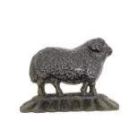 A ate 19th/early 20th century cast iron sheep with curled horns doorstop. H.17 L.23cm.