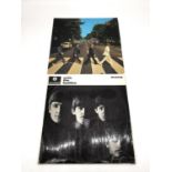 Two vintage Beatles records 'With the Beatles' and 'Abbey Road'. With the Beatles, pressing XEX