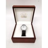 A boxed Alsal Swiss made stainless steel automatic gentleman's water resistant watch with brown