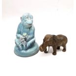 An Art Deco Beswick blue glaze monkey holding a fruit along with a Beswick elephant. Tallest H.19