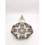 A 19th century faience hand painted ceramic fruit colander along with a Sitzendorf Art Deco exotic