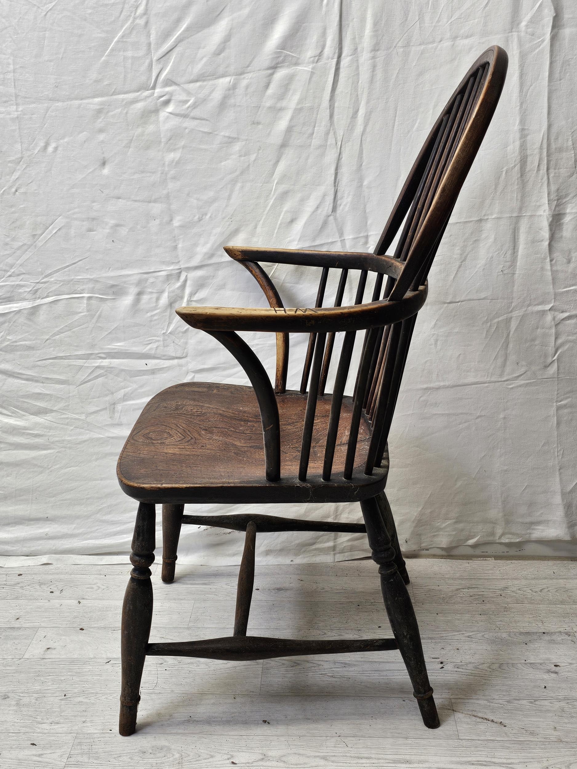 Two 19th century elm seated hoop back Windsor armchairs on turned and stretchered supports. - Image 3 of 6
