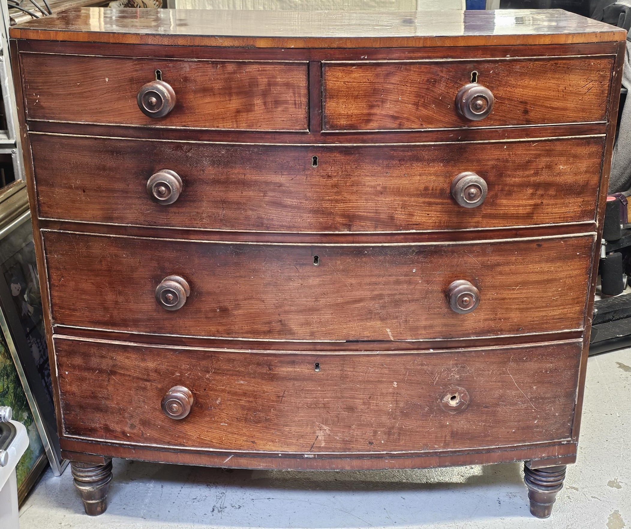 Chest of drawers, Georgian mahogany bowfronted, in need of some repair as seen. H.102 W.107 D.53cm.