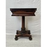 A William IV rosewood foldover top chess and card table raised on faceted column and acanthus carved