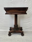 A William IV rosewood foldover top chess and card table raised on faceted column and acanthus carved