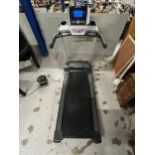 A Life Fitness folding treadmill. H.149 W.88 D.200cm. Fully working with emergency switch.