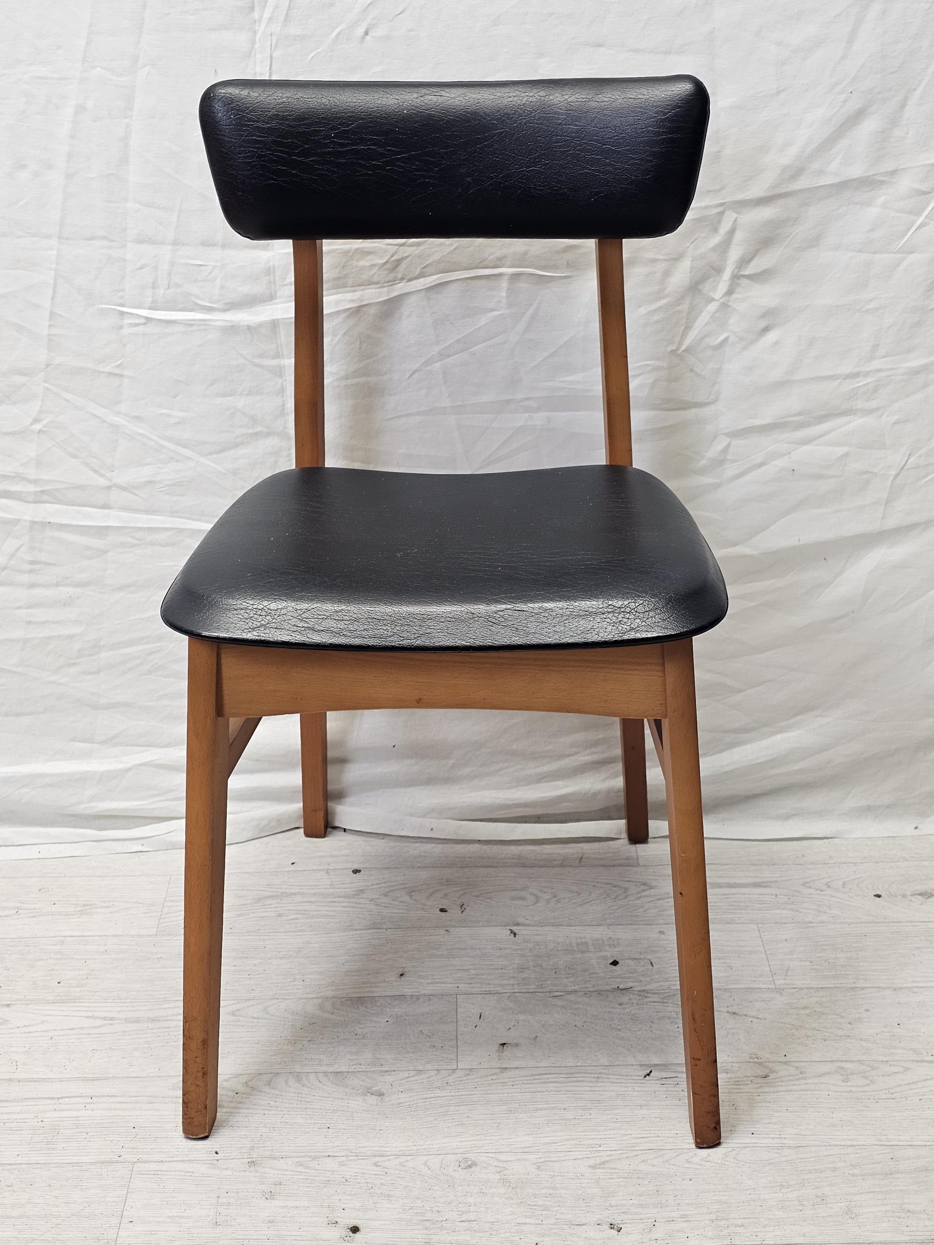 A set of four 1970's vintage teak and vinyl dining chairs by Schreiber along with a pair of similar. - Image 7 of 8