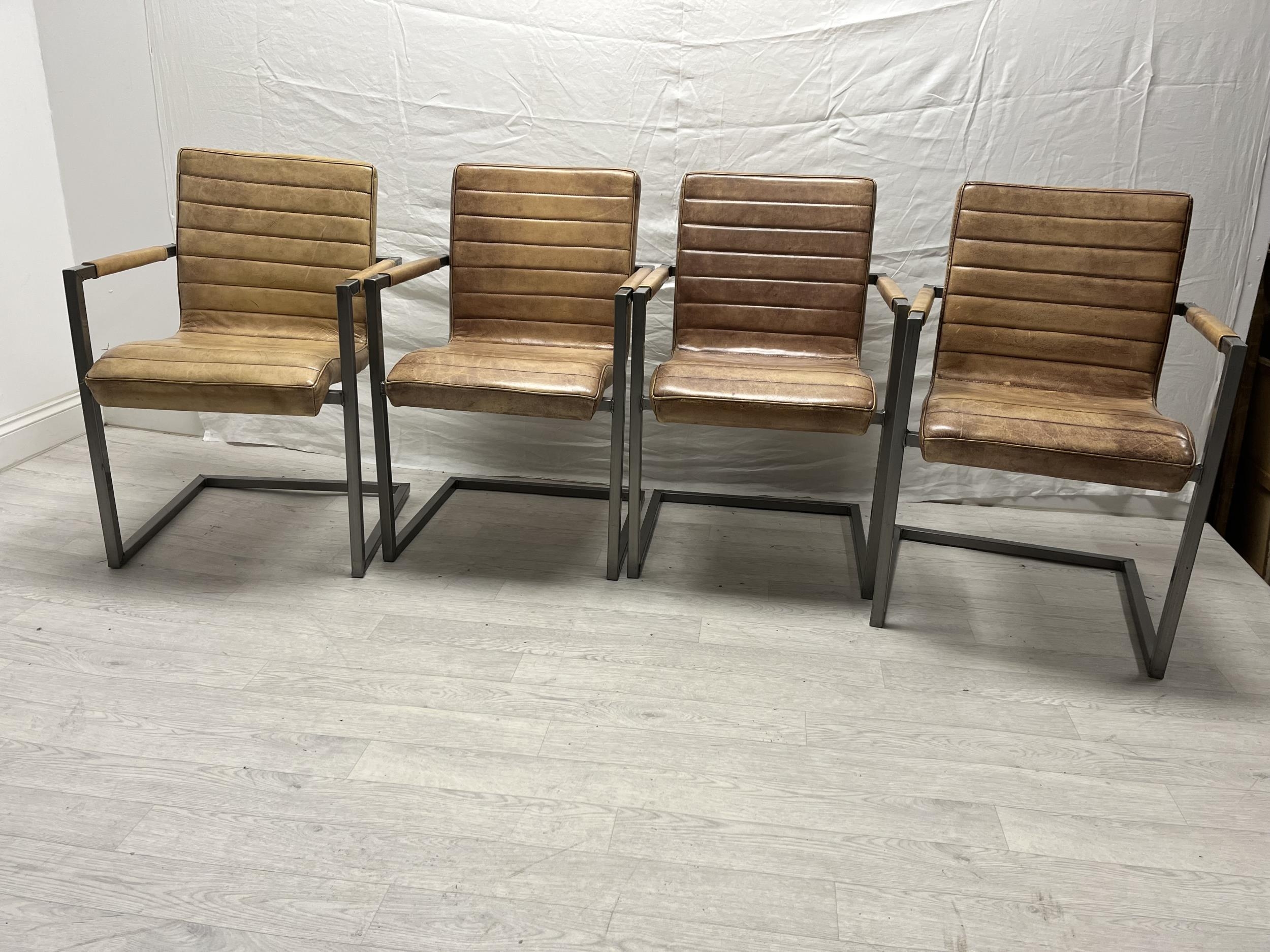 Dining armchairs, a set of four contemporary in faux leather. H.84cm.