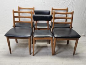 A set of four 1970's vintage teak and vinyl dining chairs by Schreiber along with a pair of similar.