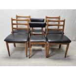 A set of four 1970's vintage teak and vinyl dining chairs by Schreiber along with a pair of similar.