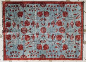 An Eastern rug with allover scrolling foliate design. H.200 W.156cm.