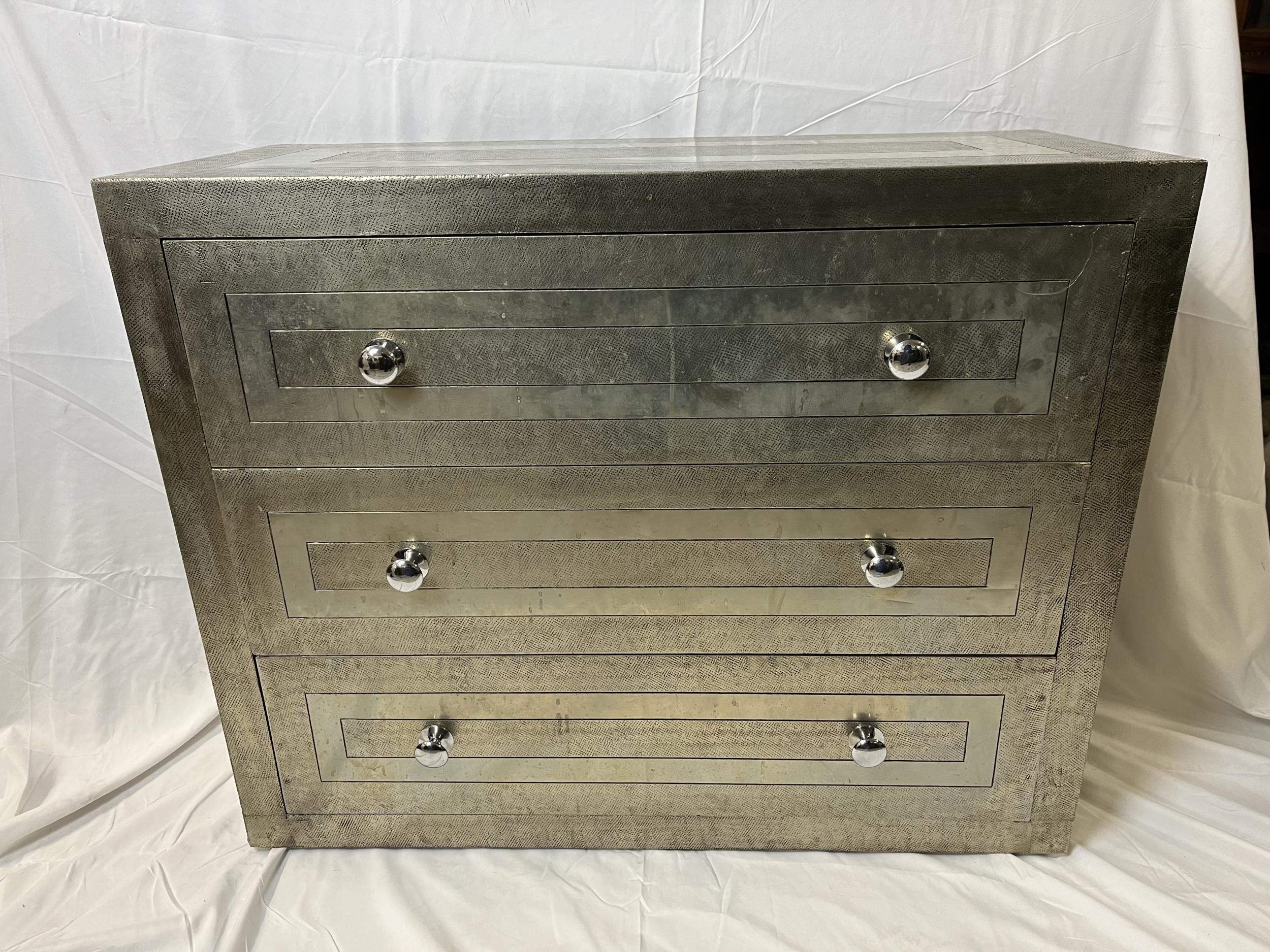 A contemporary metal bound chest of drawers. H.74 W.92 D.40cm.