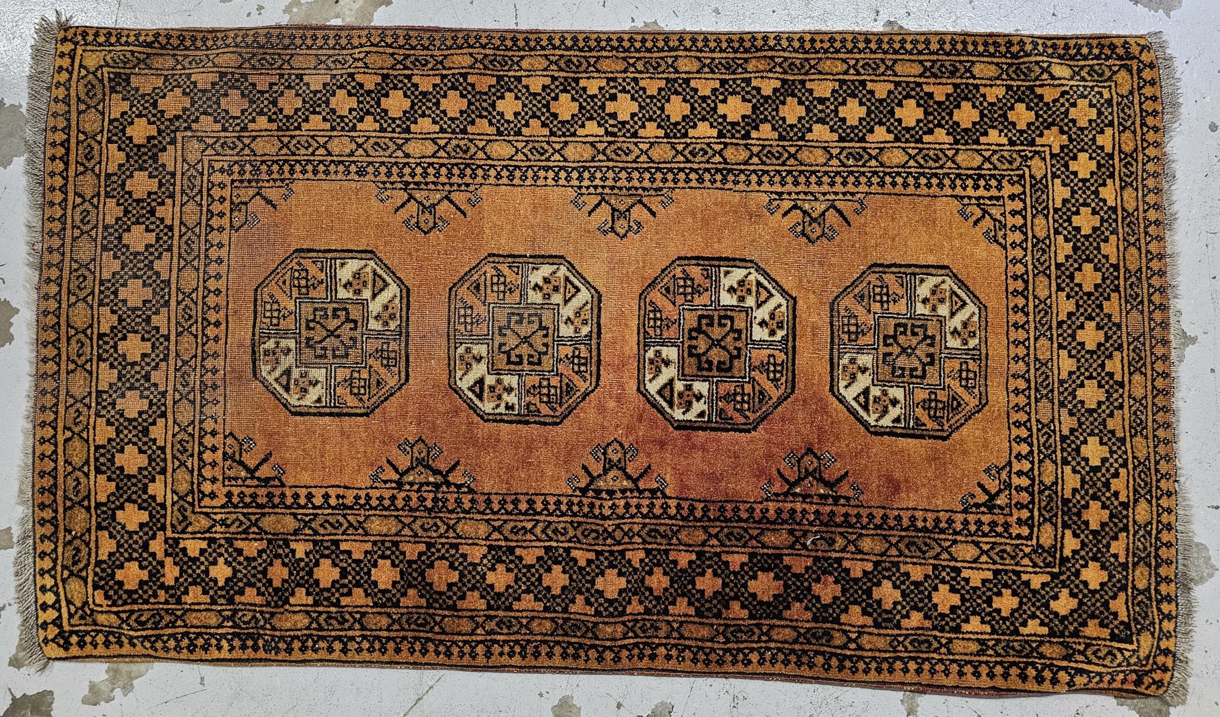 A small Afghan Bokhara rug. H.183 W.105cm.