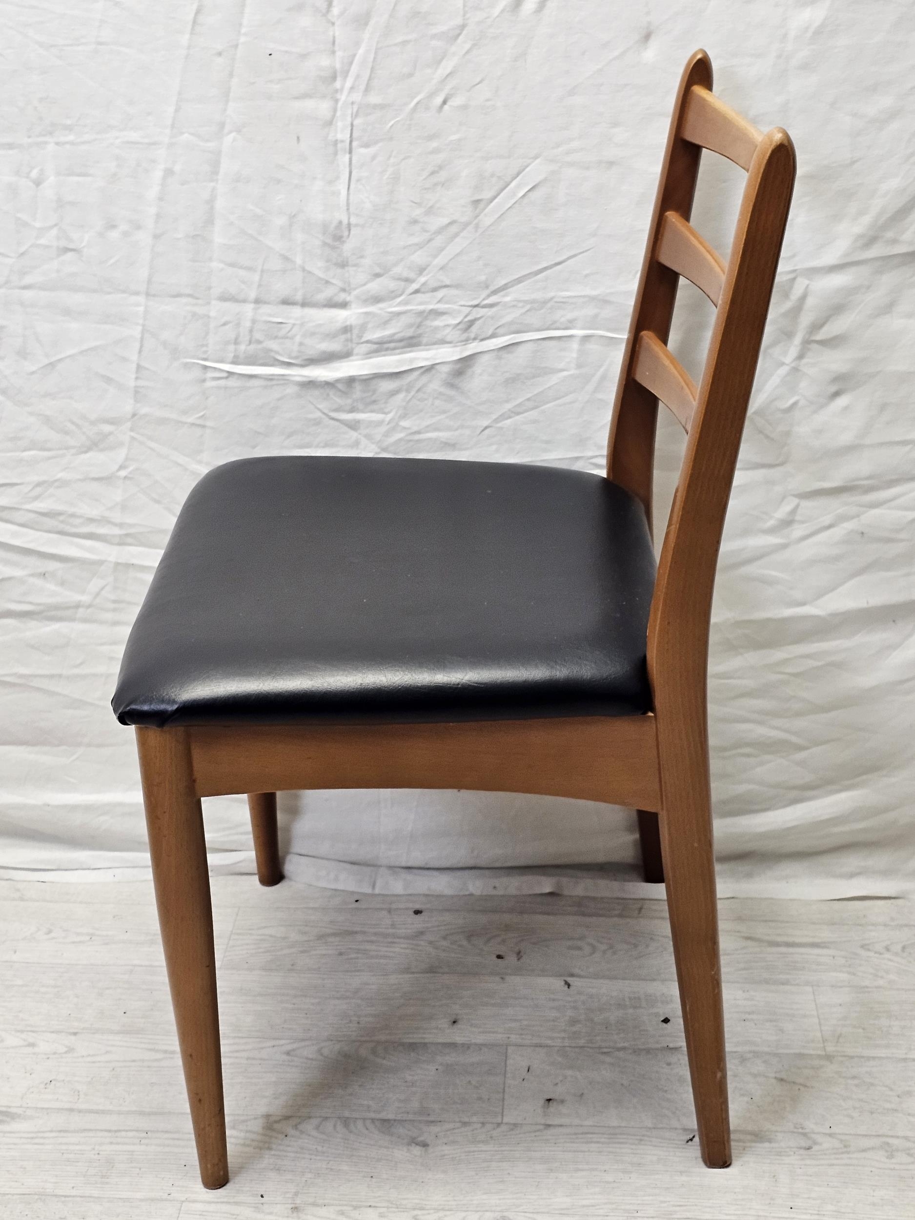 A set of four 1970's vintage teak and vinyl dining chairs by Schreiber along with a pair of similar. - Image 6 of 8