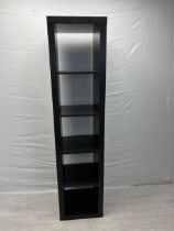 A contemporary full height narrow open bookcase. H.184.5 W.44 D.39cm.