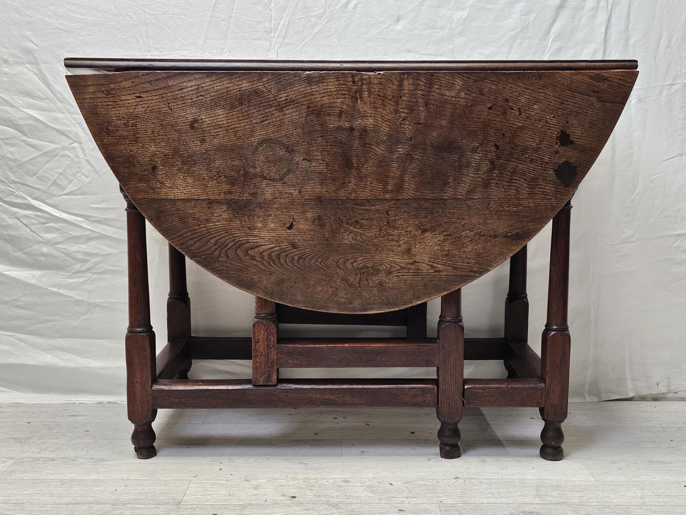 Dining table, 19th century oak with drop flap and gateleg action. H.122 D.90cm.