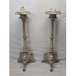 A pair of distressed painted 19th century style metal pricket candlestands. H.123cm.