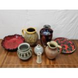 A miscellaneous collection of studio pottery, to include jugs, vases and plates. Tallest vase is