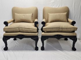 A pair of contemporary (new and unused) early Georgian armchairs with carved ebonised frames.