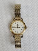 A Ladies 18ct yellow gold Omega quartz watch with Longines movement. Stretch bracelet and date