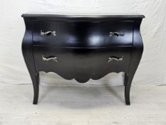 A contemporary ebonised bombe form commode chest. H.88 W.120 D.55cm.