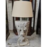 A large composite stone lion mask table lamp. H.105 W.44 D.44cm. (Height includes shade).