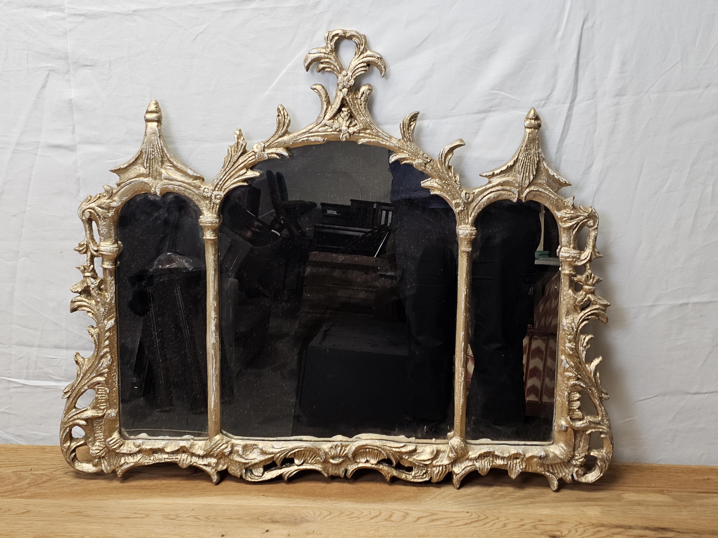 Overmantel mirror, Gilt metal Chinese Chippendale style with triple plates. H.71 W.84cm.