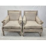 A pair of distressed painted Continental style armchairs.