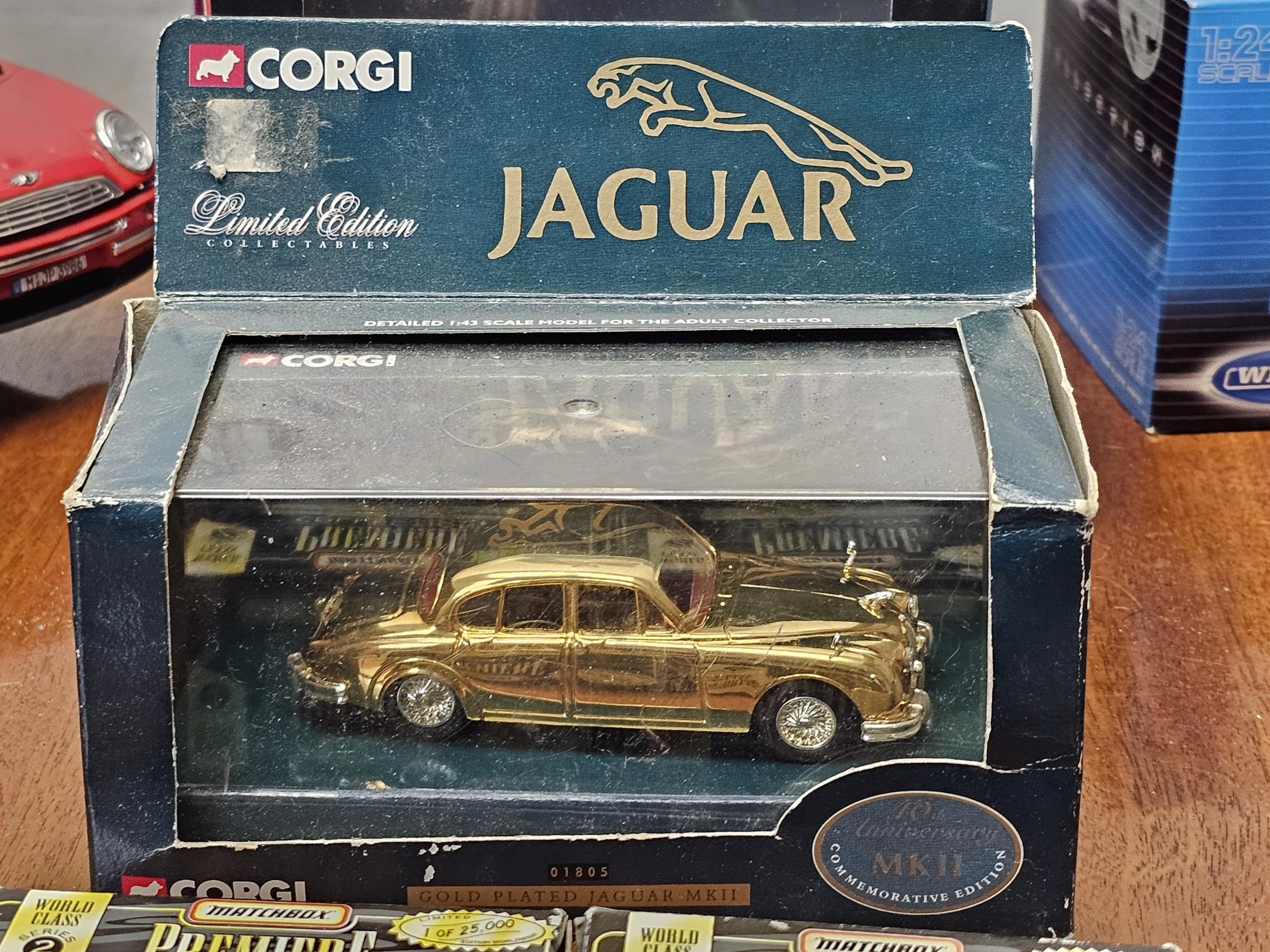 A collection of boxed vintage die-cast cars, Mini Coopers, Jaguar etc - Image 2 of 5