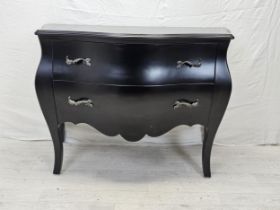 A contemporary ebonised bombe form commode chest. H.88 W.120 D.55cm.