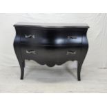 A contemporary ebonised bombe form commode chest. H.88 W.120 D.55cm.