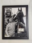 A framed photograph of Bob Champion and Aldaniti, signed by Bob Champion, with certificate. H.60 W.