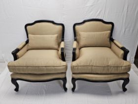 A pair of contemporary (as new) Louis XV style ebonised armchairs.