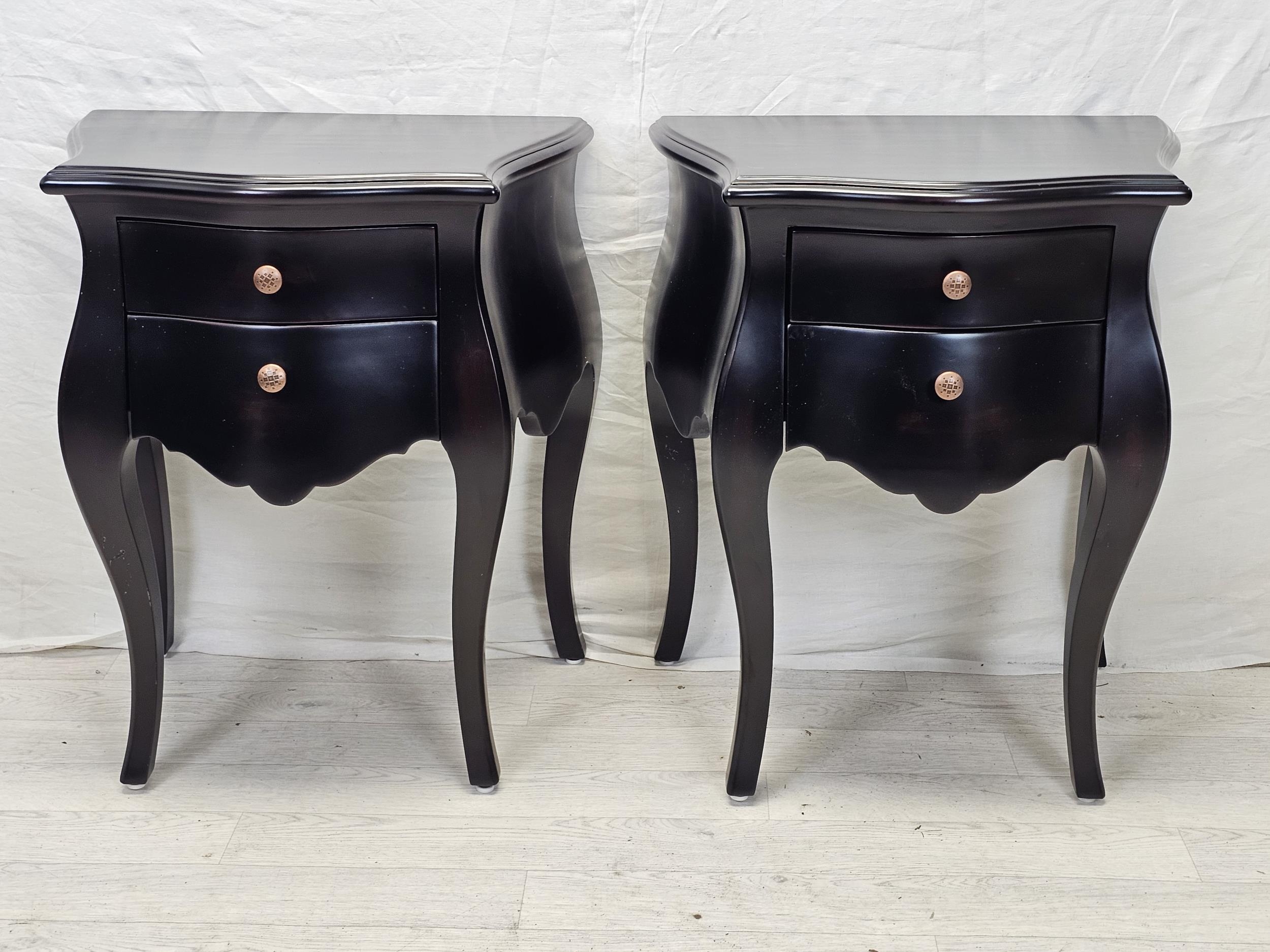 A pair of contemporary ebonised Continental style bedside chests. H.71 W.57 D.49cm.