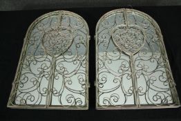 A pair of distressed painted mirrors with wrought metal doors. H.50 W.31cm. (each)