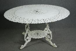 A large painted 19th century style wrought metal garden table. H.70 Dia.142cm.