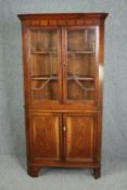 Corner cabinet, 19th century elm, floor standing in two sections. H.188 W.97 D.51cm.