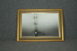 Wall mirror, contemporary gilt framed with bevelled plate. H.69 W.93cm.