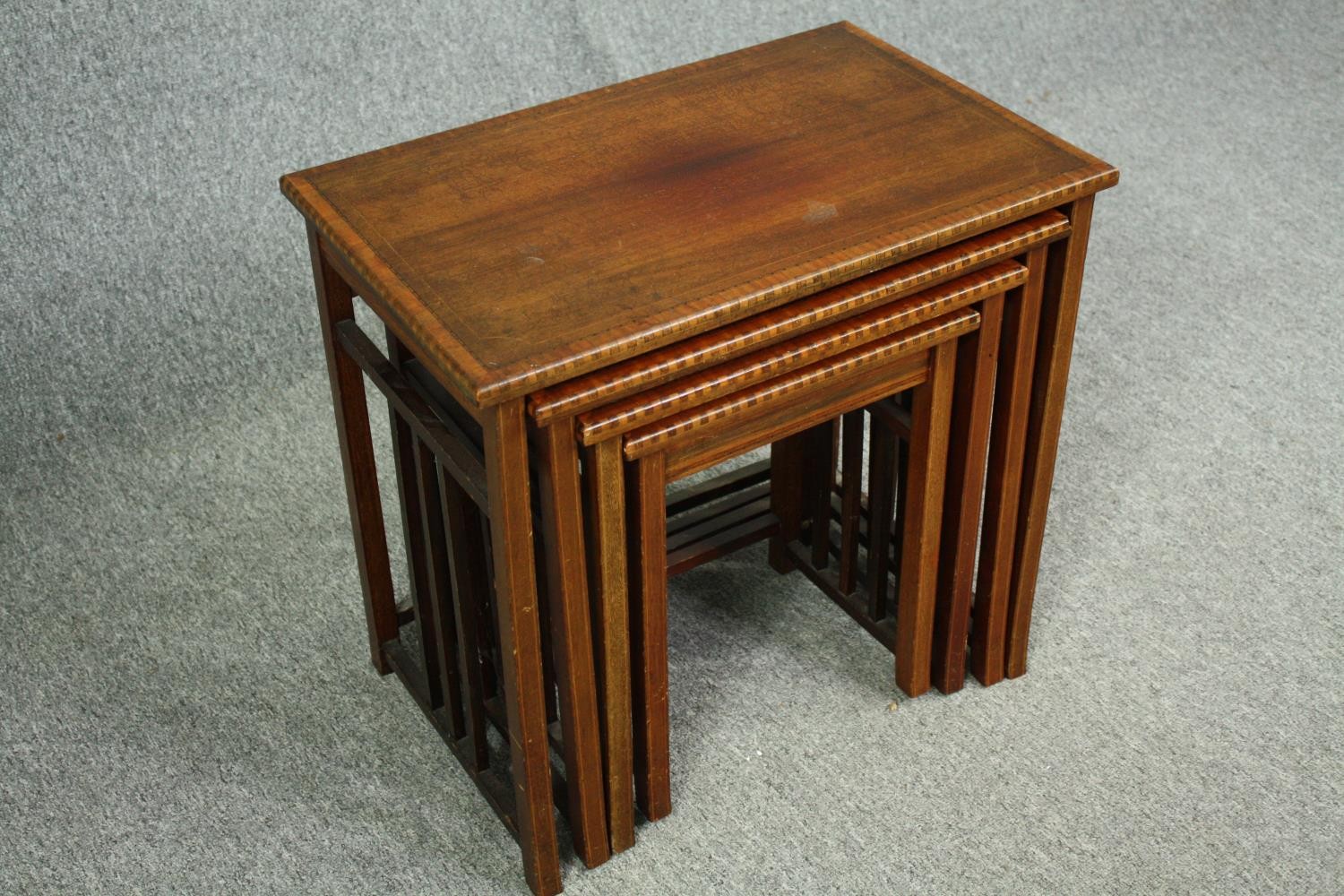 A nest of four graduating Edwardian mahogany and satinwood inlaid occasional tables. H.54 W.56 D. - Image 4 of 5