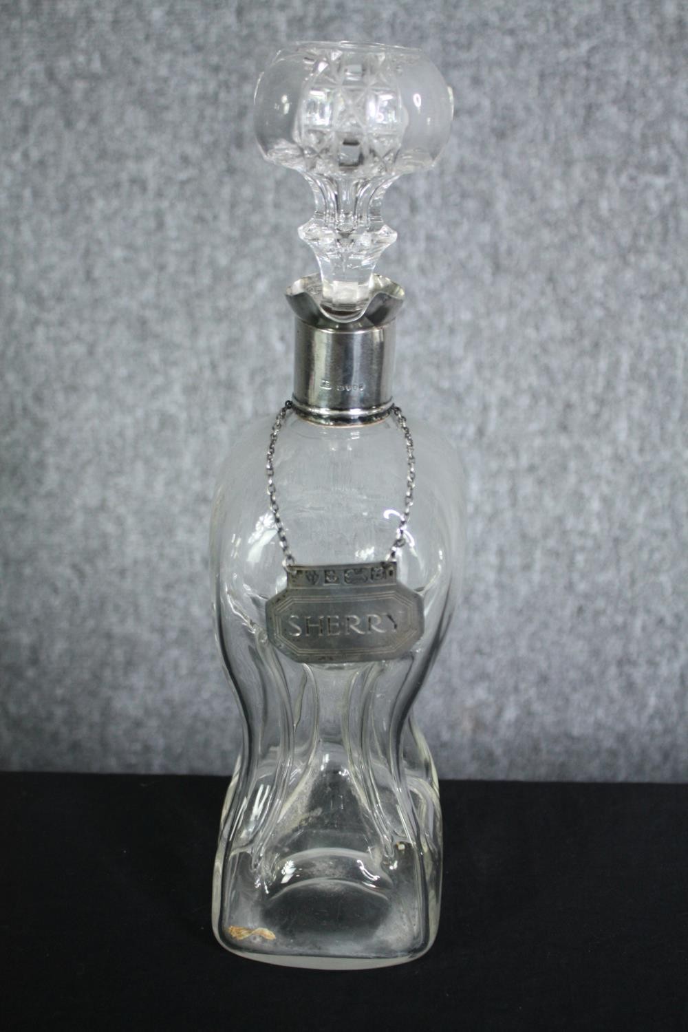 A 19th century hallmarked silver collar glug decanter with a silver sherry label. H.32cm. (