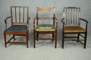 Two Georgian mahogany armchairs and a later similar chair.