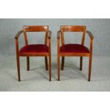 A pair of vintage armchairs.