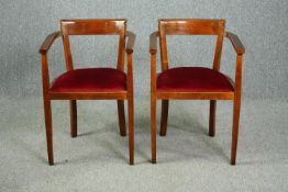 A pair of vintage armchairs.