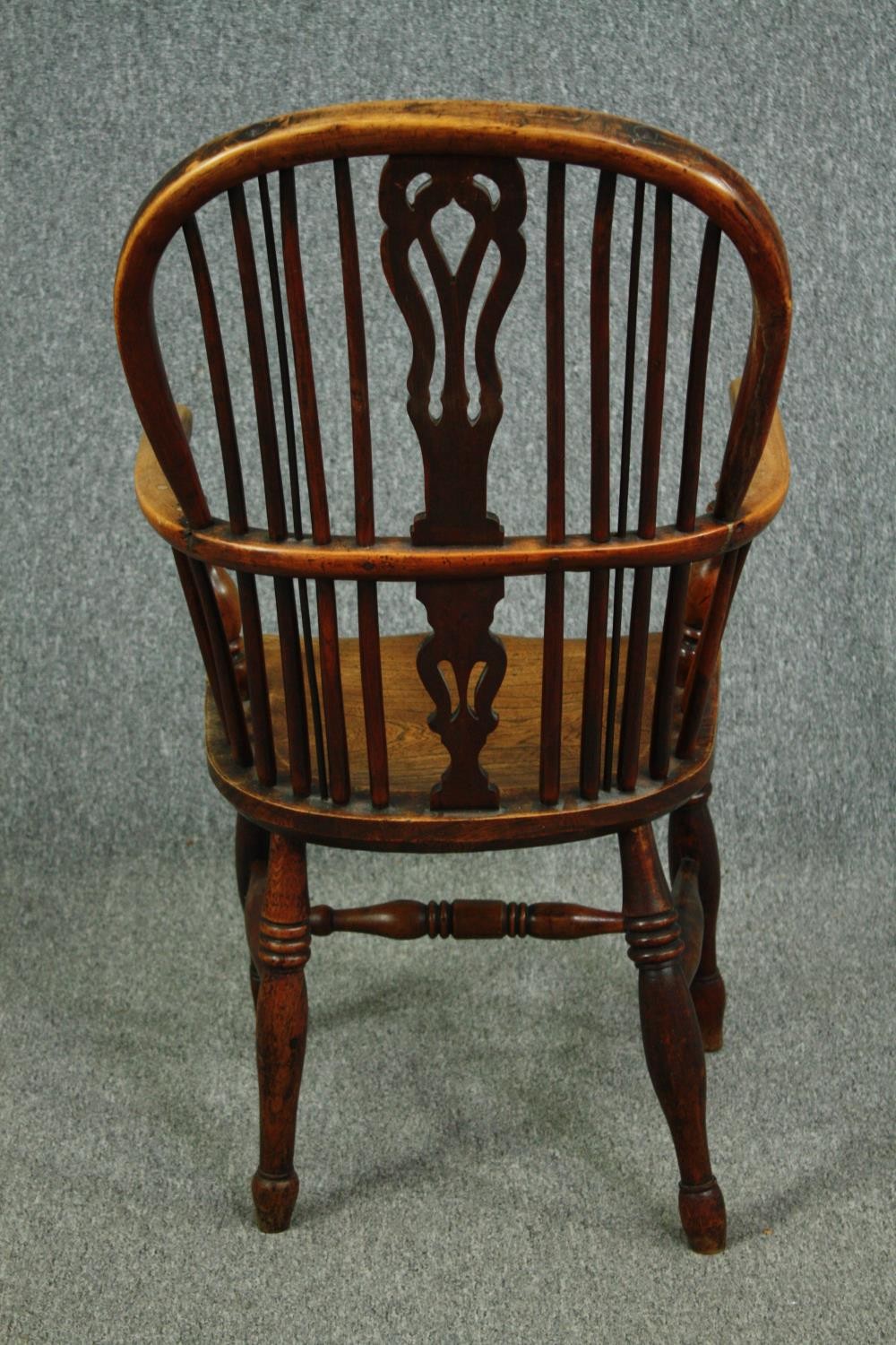 A 19th century elm and yew Windsor armchair with hooped back and pierced splat on turned stretchered - Image 4 of 7