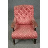 Armchair, 19th century mahogany framed in deep buttoned upholstery. H.79cm.