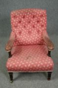 Armchair, 19th century mahogany framed in deep buttoned upholstery. H.79cm.