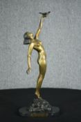 Pierre le Faguays, French (1892 - 1962), a patinated bronze figure, Girl with Dove” H.56cm.