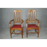 Armchairs, a pair Arts and Crafts oak with tulip motifs to the back splats. H.110cm. (each).