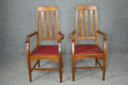 Armchairs, a pair Arts and Crafts oak with tulip motifs to the back splats. H.110cm. (each).