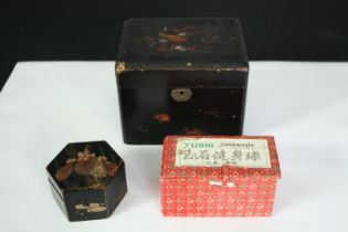 Two Japan lacquered and hand decorated boxes along with boxed glass meditation balls. H.13 W.16 D.
